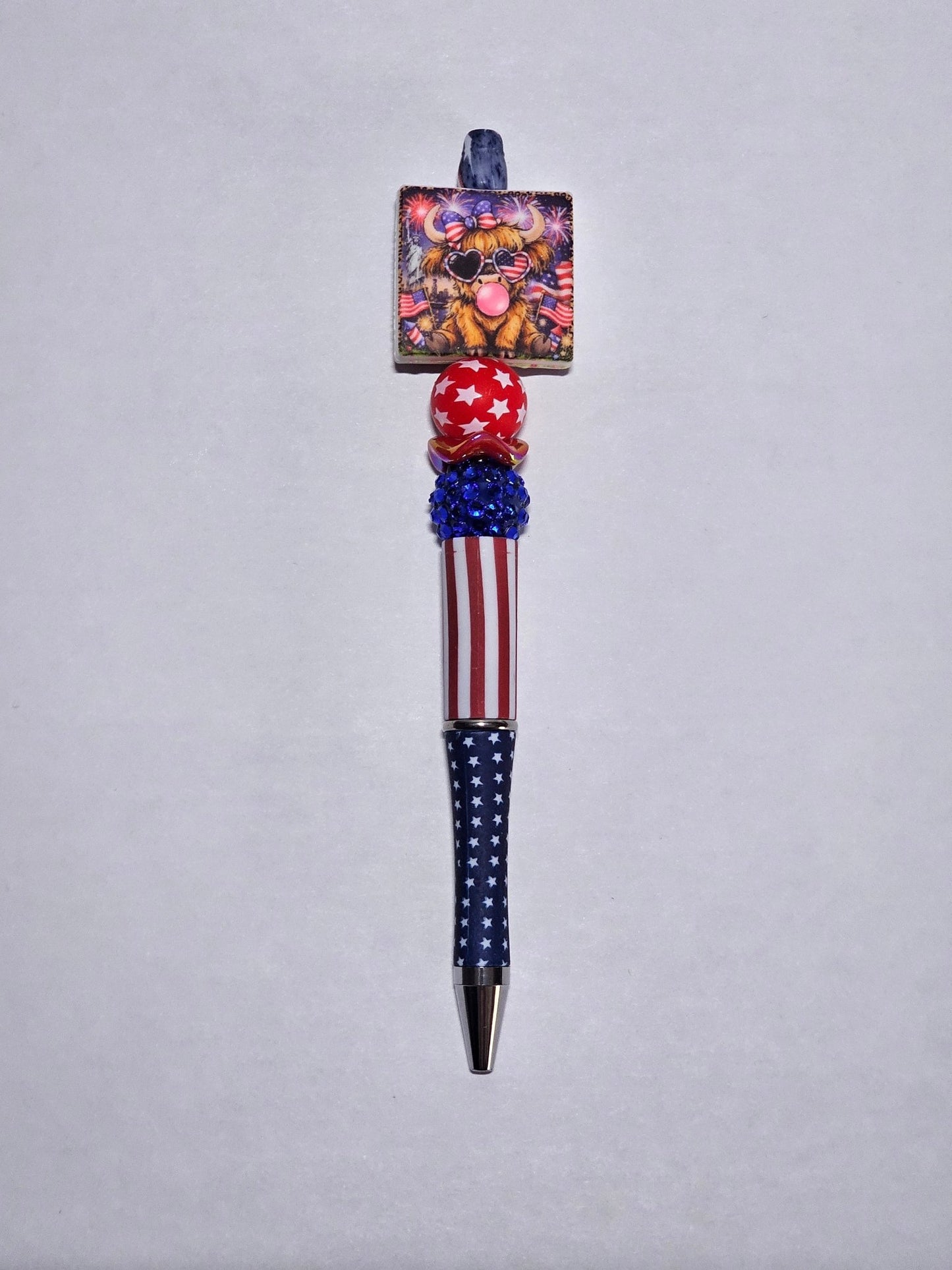 New 1 Count Focal Bead American Cow. Pen is example bead only