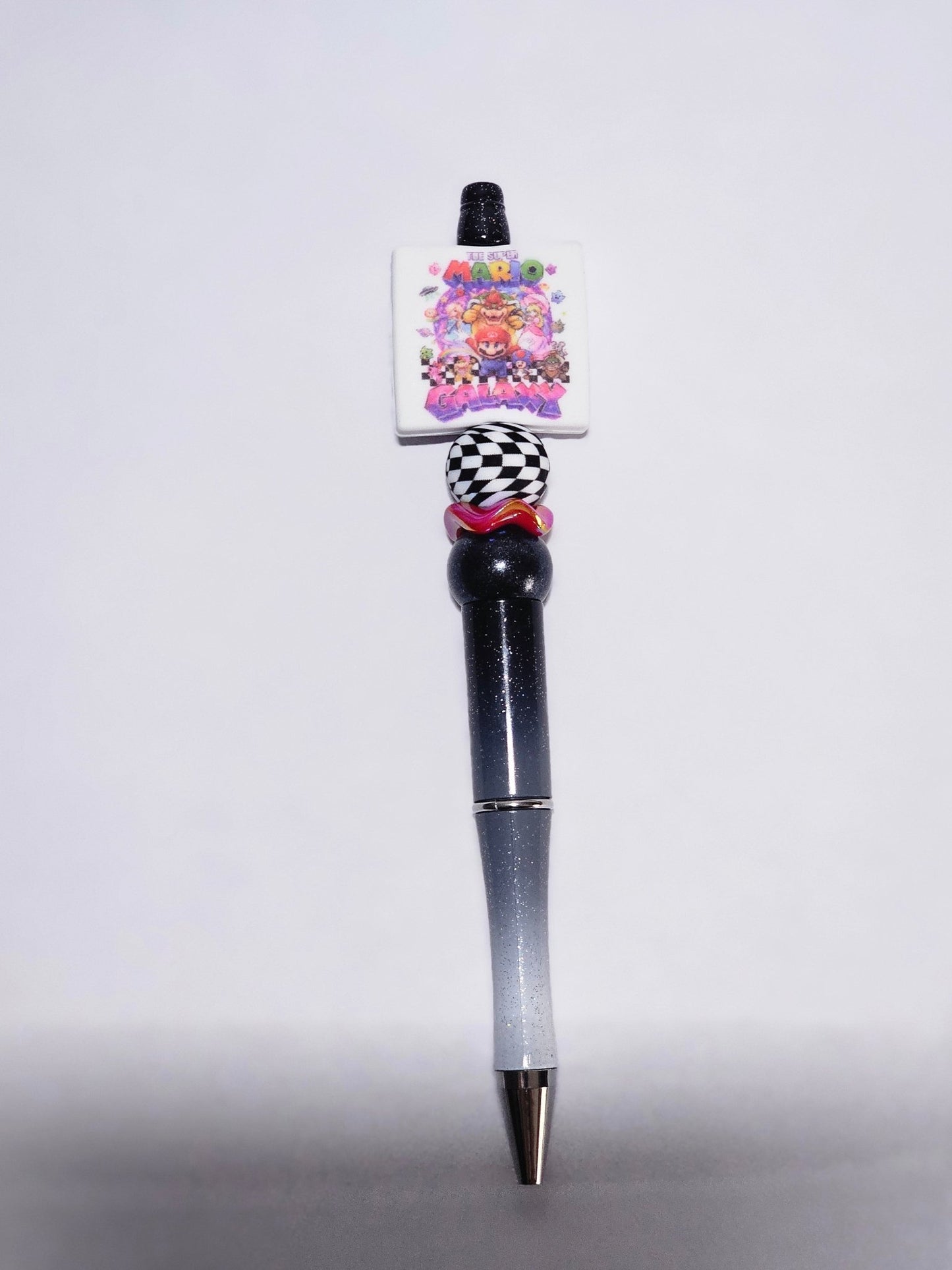 New 1 Count Focal Bead Mario Galaxy.  Pen is example bead only