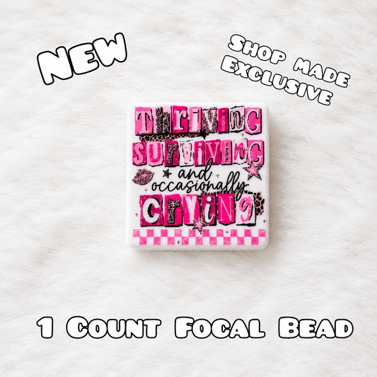 New 1 Count Focal Bead Thriving Surviving and occasionally crying.  Pen is example bead only
