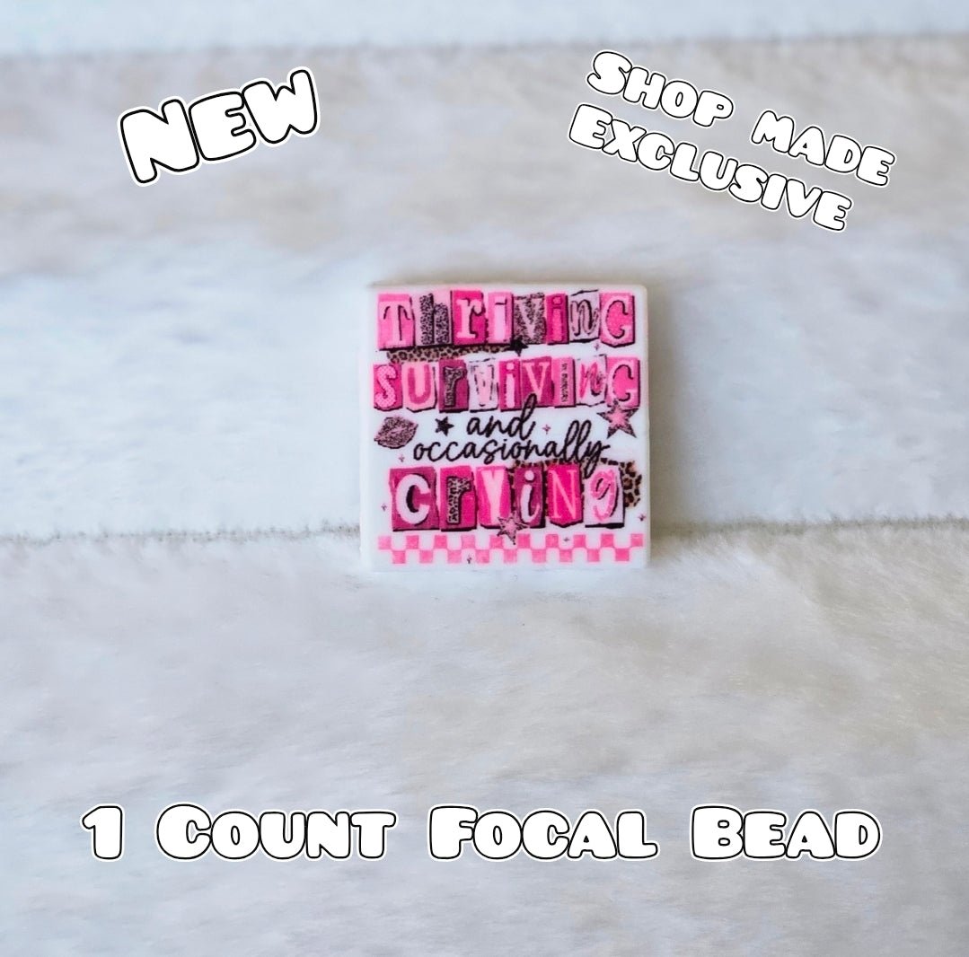 New 1 Count Focal Bead Thriving Surviving and occasionally crying.  Pen is example bead only